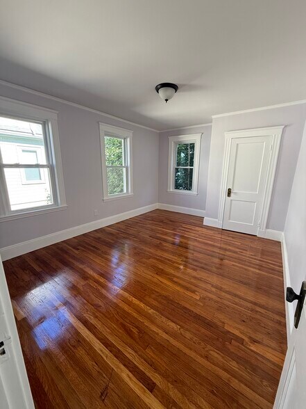 Back bedroom is the largest with space for a king size bed and work station. 3 windows and closet. - 27 Seven Pines Ave