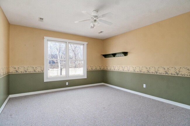 upstairs bedroom - wallpaper will be removed and room repainted - 4907 S Buckingham Ln