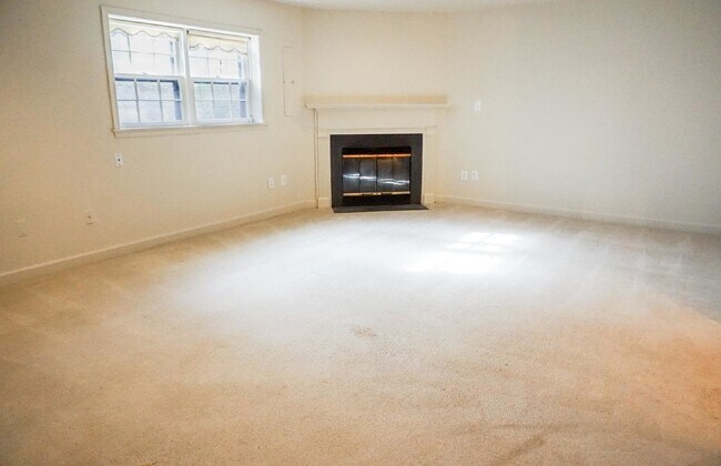 Building Photo - Beautiful brick townhome featuring three f...