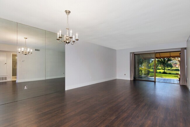 Building Photo - Lake and Golf Course View- Remodeled Condo w/ 2 Car Garage!