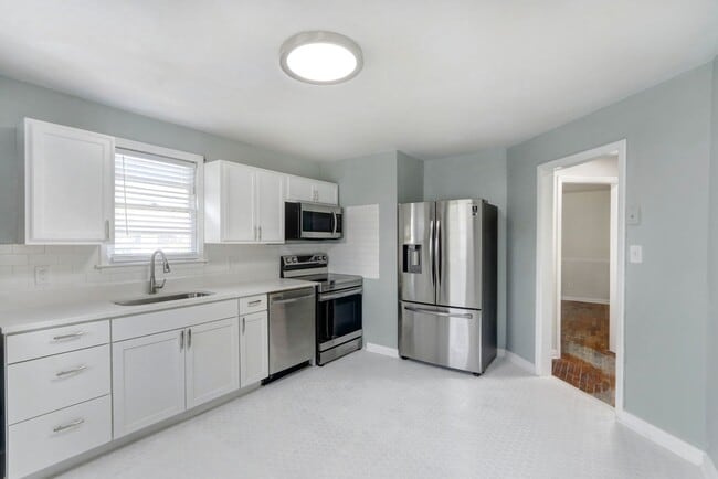 Building Photo - Renovated Three Bedroom House with large yard