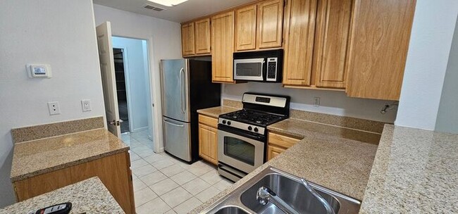 Building Photo - TANAMERA CONDOMINIUMS 1 bed 1 bath 1 car g...