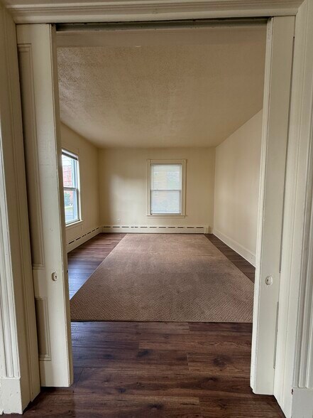 Bedroom with pocket doors and pergo floors - 224 E Main St
