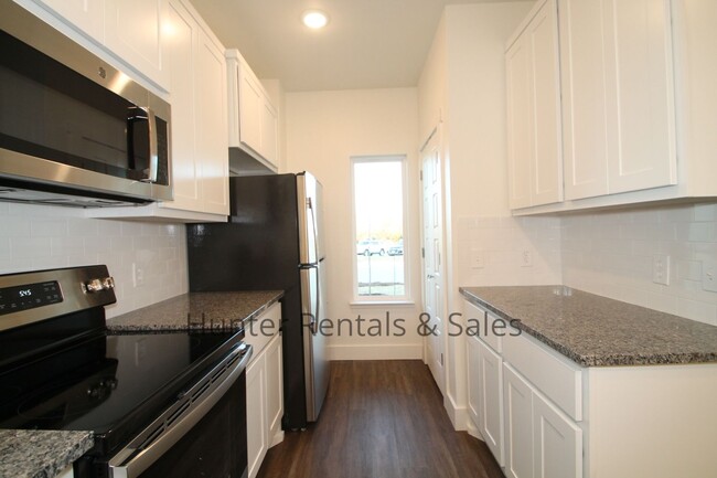 Building Photo - Upscale Four-Bedroom Townhome!