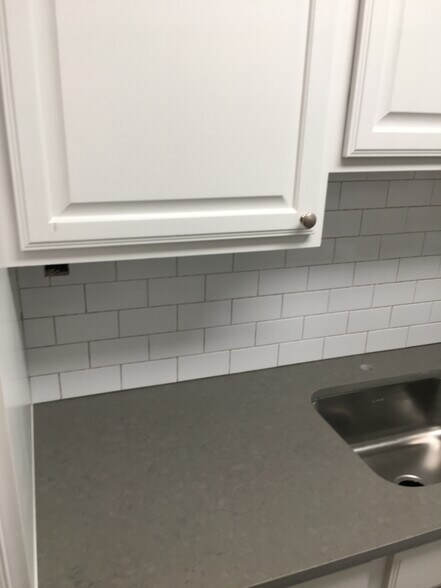 Backsplash, counter and cabinets - 27 Northill St