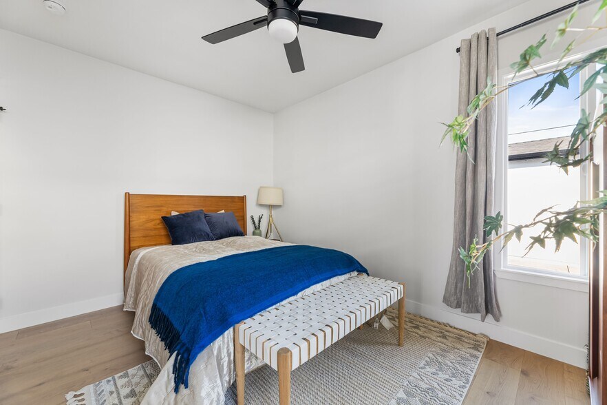2nd bedroom with large closet, West Elm furniture, and flat screen TV. - 1823 N Ditman Ave