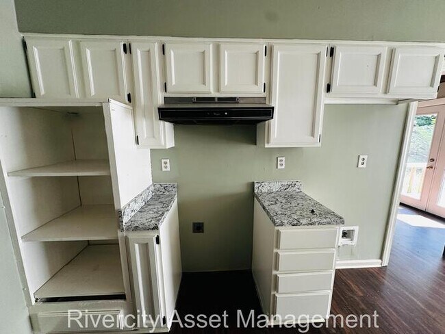 Building Photo - charming three-bedroom, two-full-bath resi...