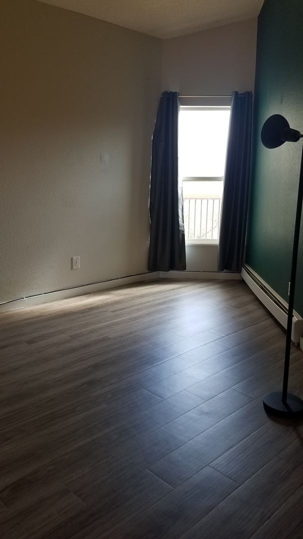 Building Photo - Year Lease 3 bedroom unit with Carport and...