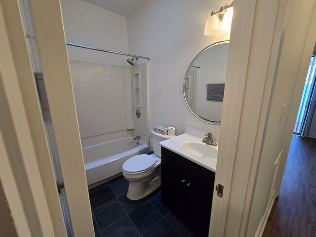 Building Photo - Multigenerational or Grad Student Living! Spacious One-Story End Unit in Prime Location on 54