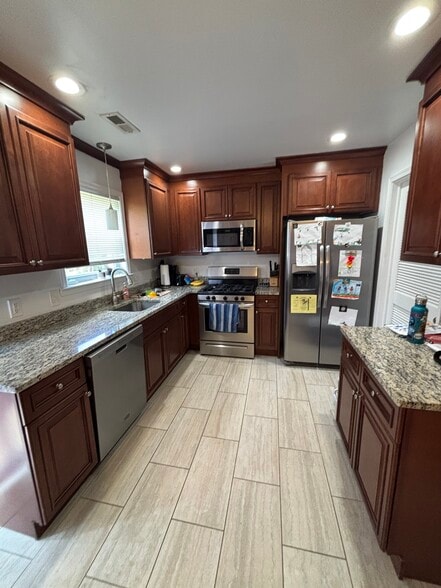 Kitchen with Stainless Steel Appliances and Granite Countertops - 34 Eaves Mill Rd