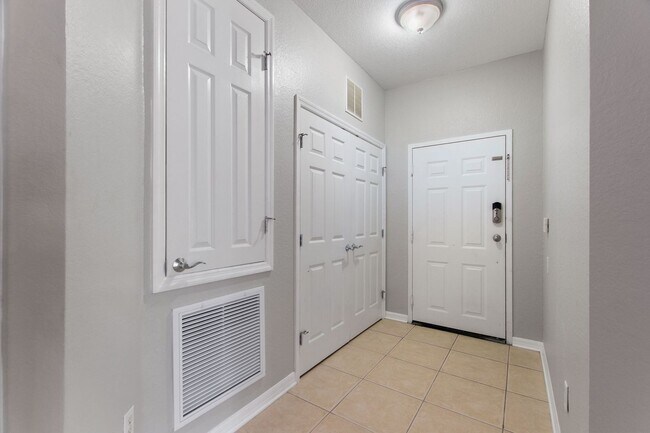 Building Photo - First floor condo in Champions Gate! Ready...