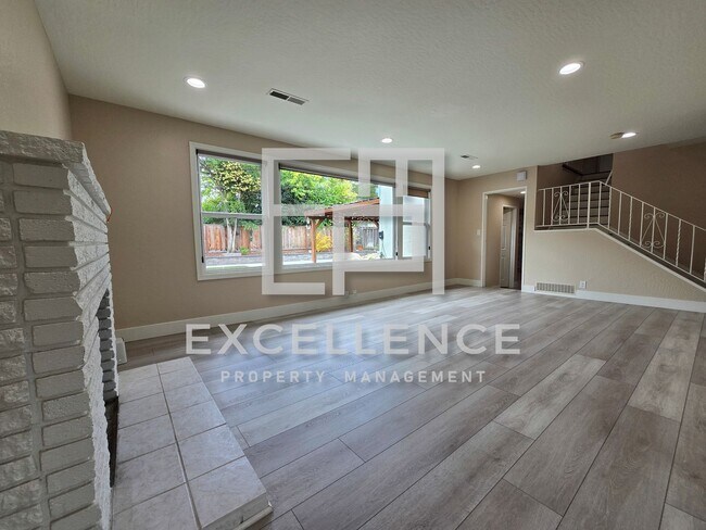 Building Photo - Beautiful 3/2.5 Home With 2 Fireplaces, Updated Kitchen, Spacious Yard and Covered Patio