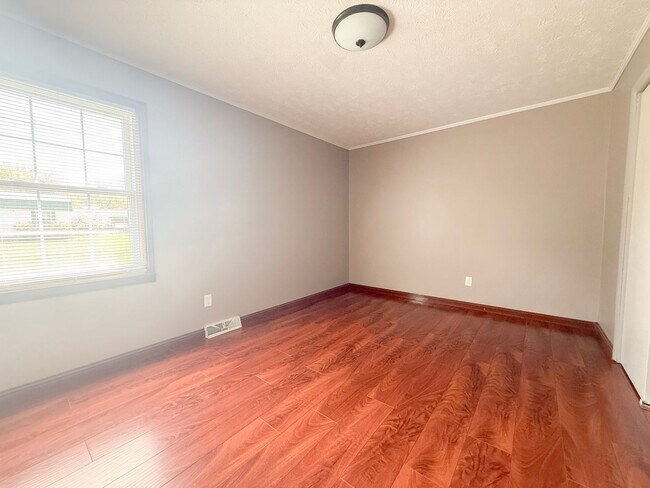 Building Photo - Spacious 3-Bedroom Home with Huge Yard, Covered Porches & Storage Building