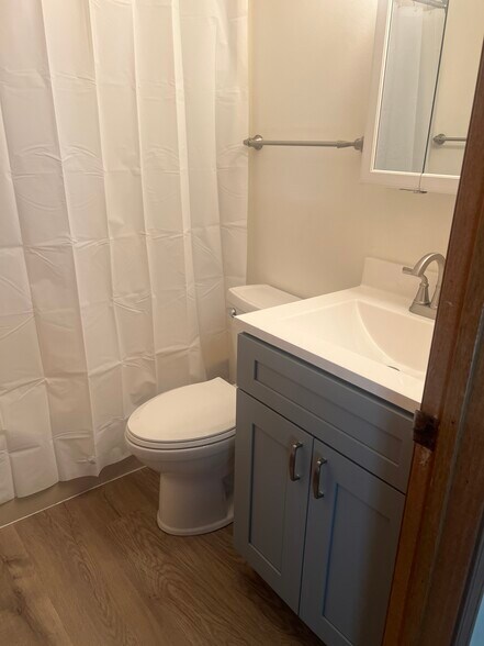 Upstairs bathroom. New vanity and toilet. - 2569 Parkview St