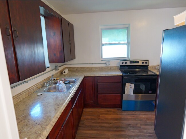 Kitchen with new appliances. - 72 M L King Ave