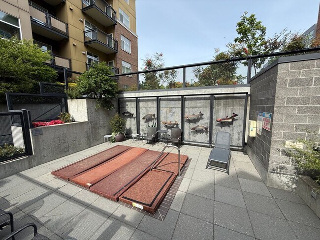 Building Photo - Modern 1BR Condo with Luxury Amenities in ...
