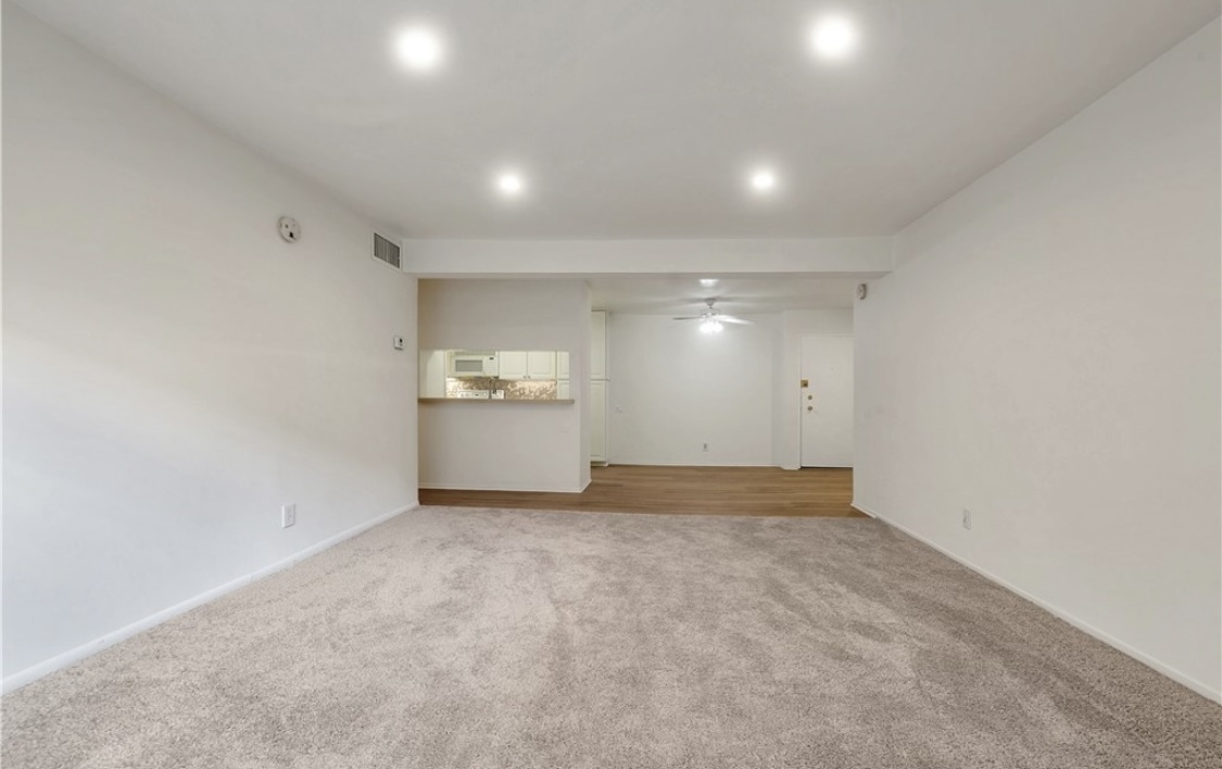 Replaced the carpet with wood vinyl floor - 5460 White Oak Ave