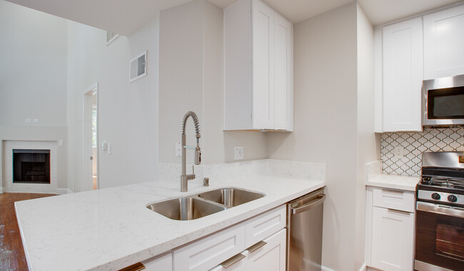 Beautiful renovated kitchens that open up to the living room - Hillcreste Apartment Homes