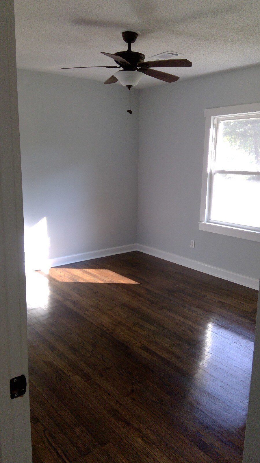 Bedrooms 3, with beautiful hardwood floors and stylish gray paint throughout. - 680 Tom Read Dr