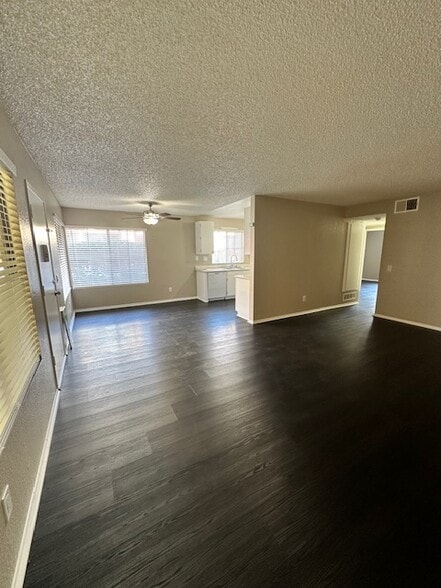 View from corner of the living room towards dining area/kitchen - 7385 Lariat Pl