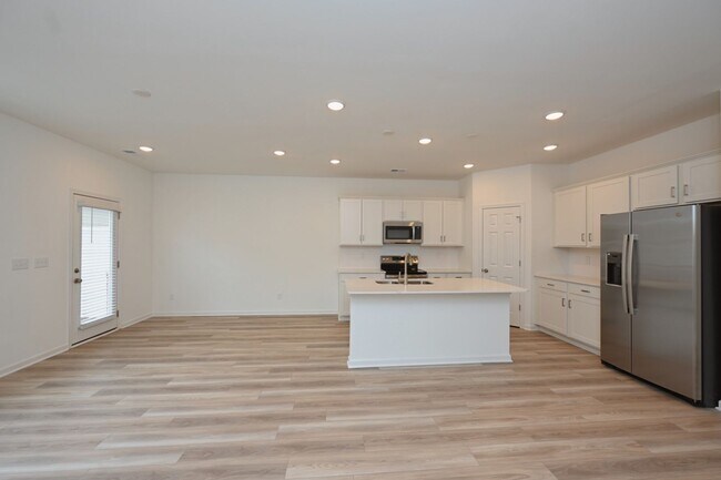 Building Photo - **BE THE LUCKY ONE TO LIVE IN THIS 2024-BUILT BRICK TOWNHOME IN THE VILLAS AT REGAL SQUARE FEATUR...