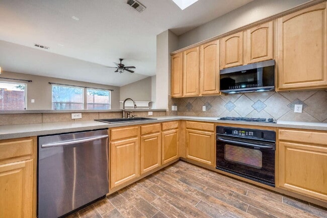 Building Photo - Modern Brick Home with Skylit Kitchen and Private Backyard