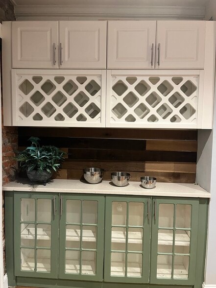 Kitchen w/glass front cabinets & wine rack - 223 Jackson St