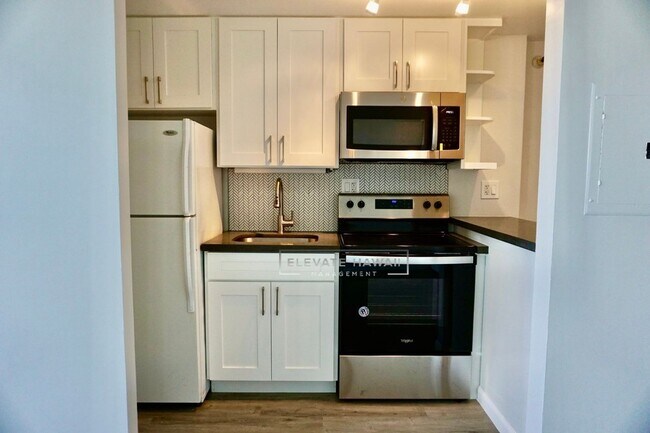 Building Photo - RENOVATED, PENTHOUSE VIEWS - Studio Unit i...