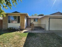 Building Photo - Adorable 4/2 With GREAT Backyard.  Gardene...