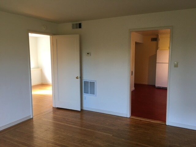 Door to bedroom, looking into kitchen. - 43 Bishop Rd