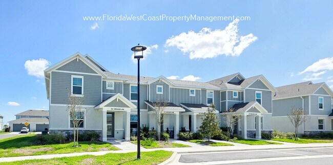 Building Photo - EXCEPTIONAL AND SPACIOUS FURNISHED TOWNHOME WITHIN WATERSIDE- NAUTIQUE!