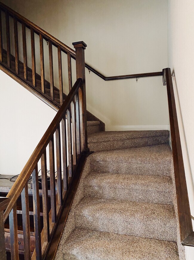 Stairs to upper level - 8500 Redpoint Way