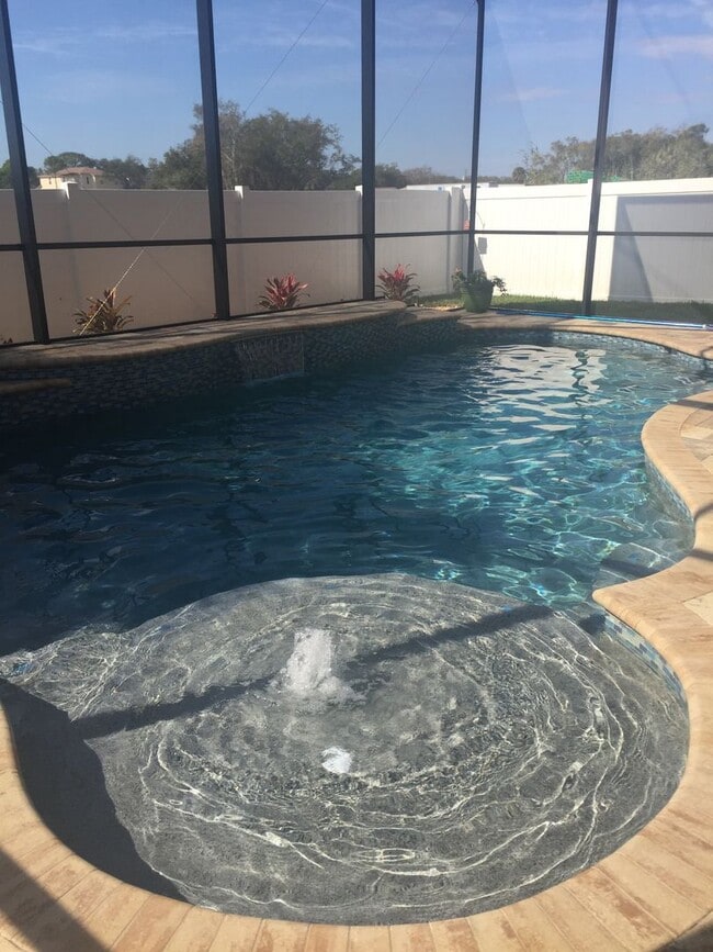 Building Photo - Stunning 4-Bed, 3-Bath Home with Screened-...