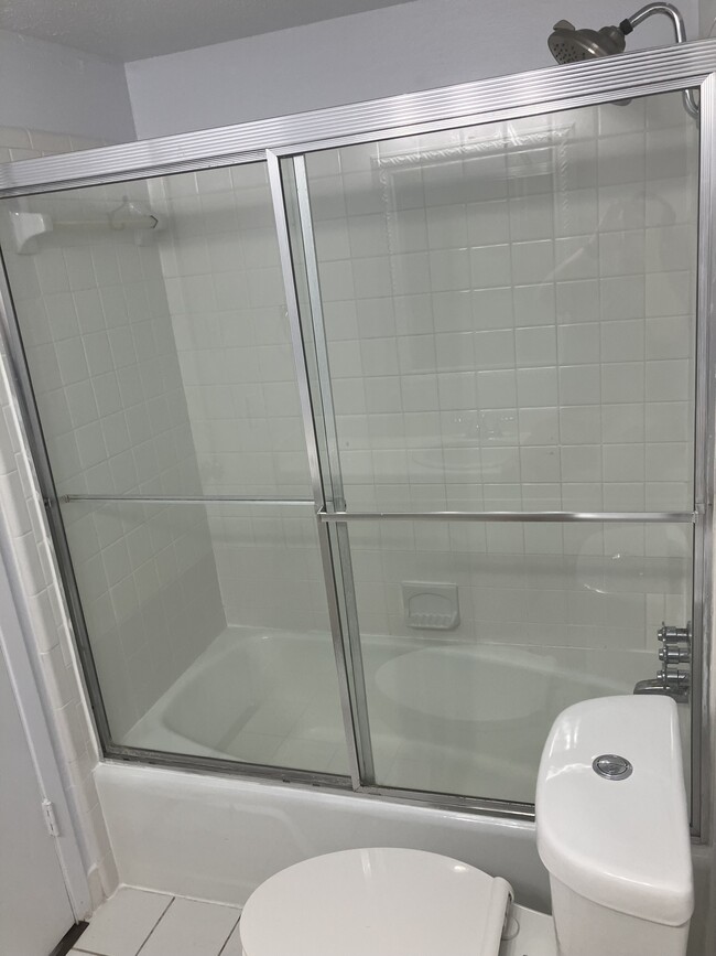 Enclosed shower and nice shower head to make relaxation a daily activity. - 13559 Red Fern Ln