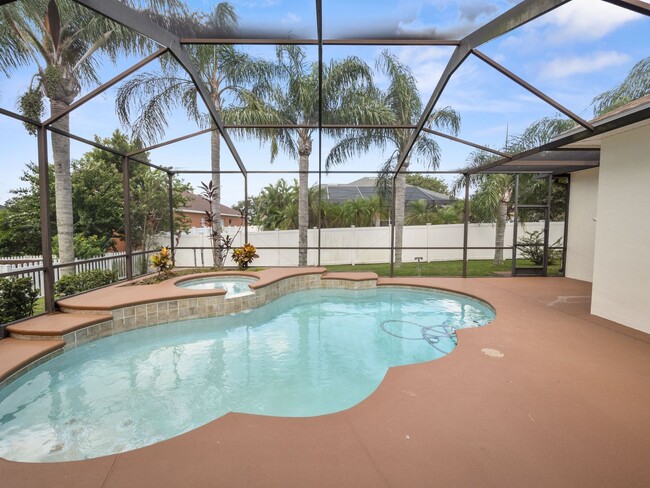 Building Photo - Gated Community Gem 4/3 with Pool & Spa in...