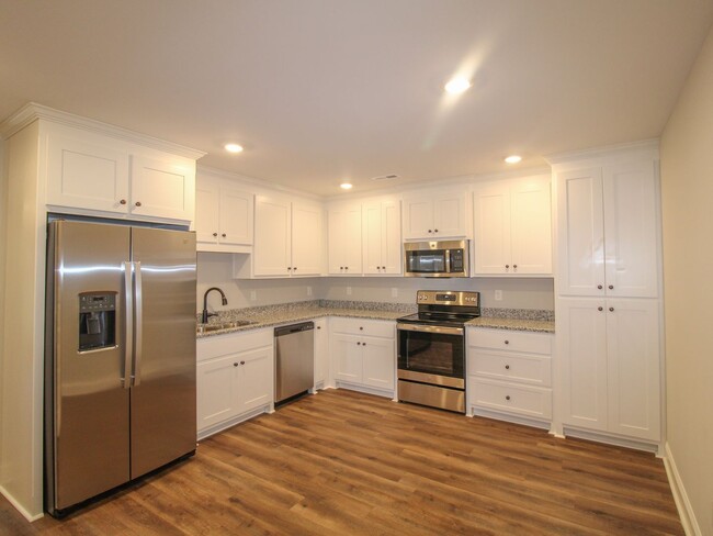 Building Photo - New 4 BR Corner Unit Townhome at Lucas Fer...