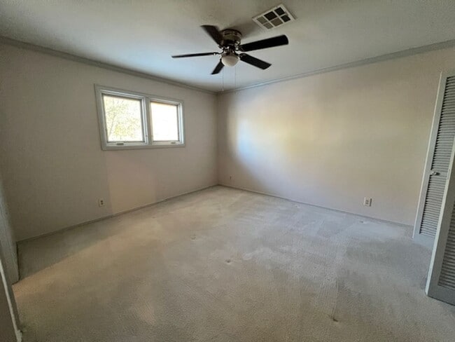 Building Photo - Step into this inviting, sunlit home where space and comfort blend seamlessly