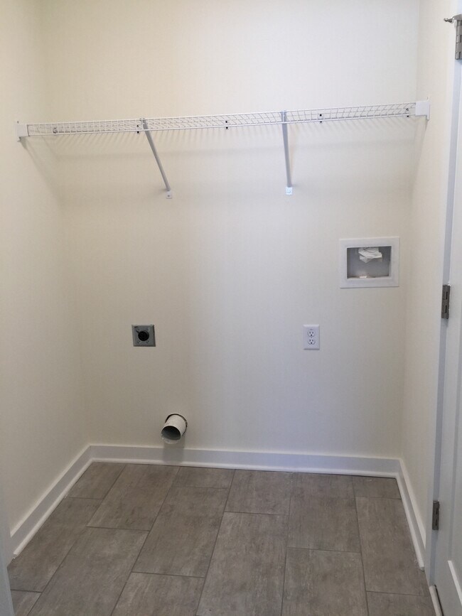Laundry area between at garage entry - 17 East St