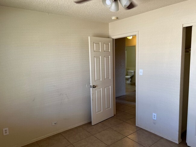 Building Photo - Four Bedroom Mountain View Home with large fenced back yard and double gates