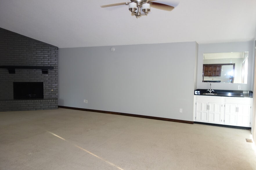 large vaulted and beamed Living room with bar area on right - 3324 E 73rd St
