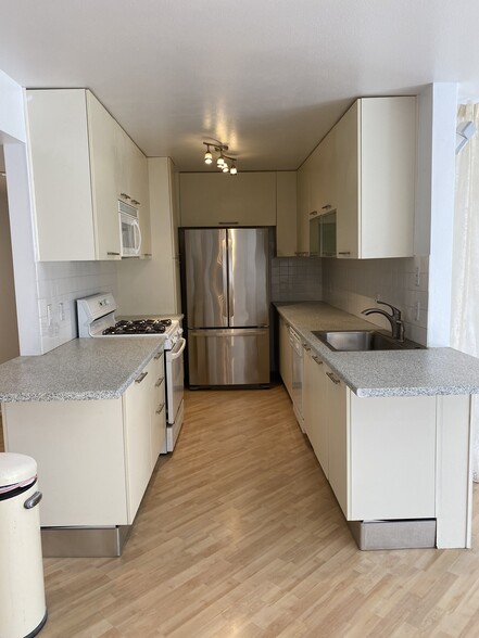 Kitchen with brand new fridge and dishwasher - 2121 Beloit Ave