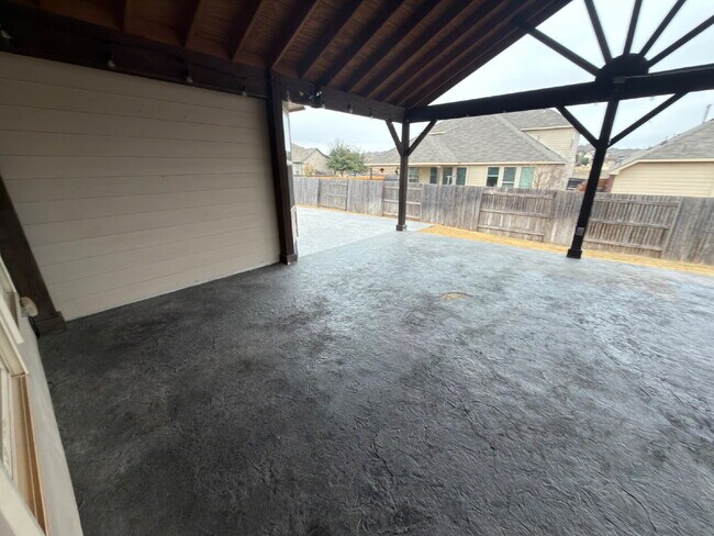 Building Photo - Four bed two bath on a corner lot with a pool in Sunfield. Gas cook top, double ovens. Open kitch...