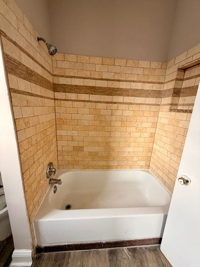 Building Photo - Huge townhome available. Four bedrooms three bath.