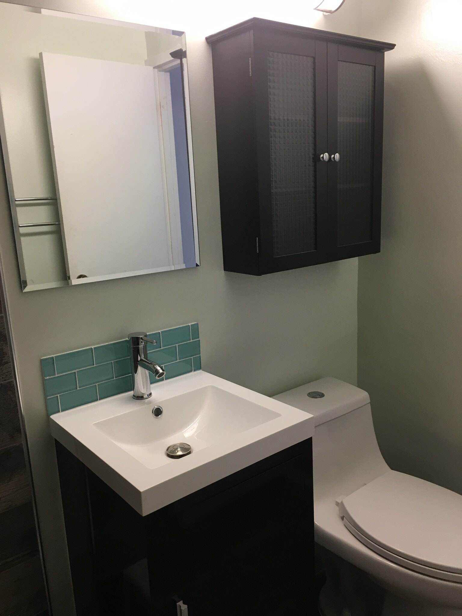 bath has new vanity, sink, tile, toilet, cabinet, mirror and lighting - 1121 Arlington Blvd
