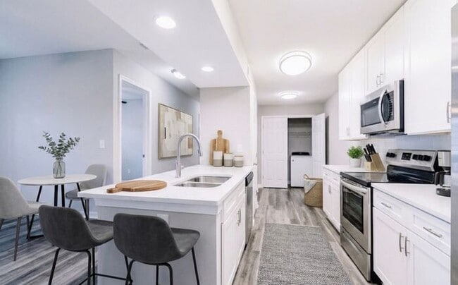 Building Photo - Spacious 2-Bedroom Elite Apartment with Private Balconies & Washer/Dryer