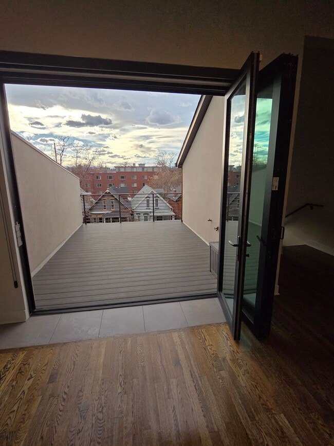 Building Photo - STUNNING 4-LEVEL TOWNHOME IN HIGHLANDS WITH SAUNA, 2-CAR GARAGE + AMAZING ROOFTOP DECK!