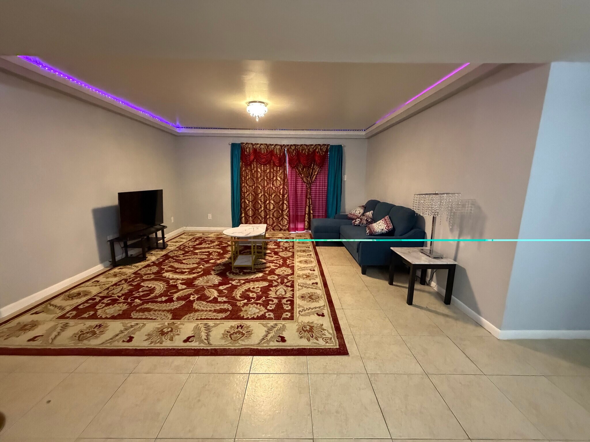 Spacious open-concept living and dining area with modern finishes and natural light. - 8427 Hearth Dr