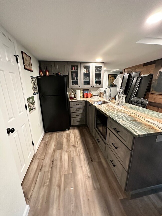 Building Photo - Dream Home in Highland, Michigan: Your Private Oasis on 5 Wooded Acres