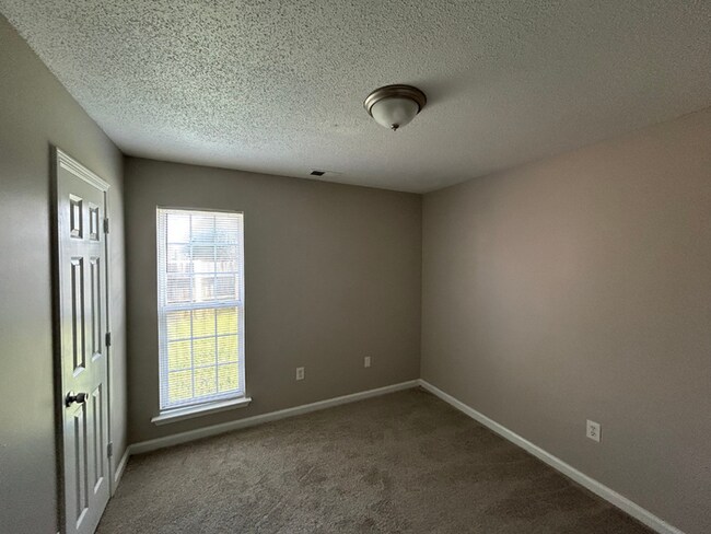 Building Photo - Spacious 4BR/2BA Olive Branch Home | 1,965 Sq Ft, Modern Fireplace, Bay Window & 2-Car Garage