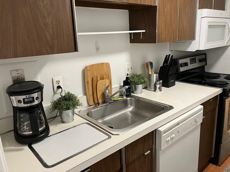 Full kitchen with microwave, dish washer, stove, coffee maker, utensils, pots & pans etc. - 8200 E Jefferson Ave